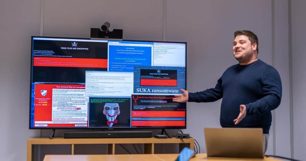 Employees attending a cybersecurity training session: "Employee Cybersecurity Training"