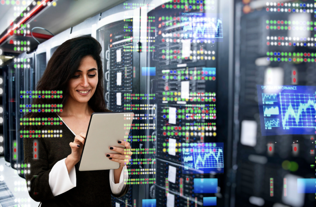 female IT engineer studying tablet in data centre